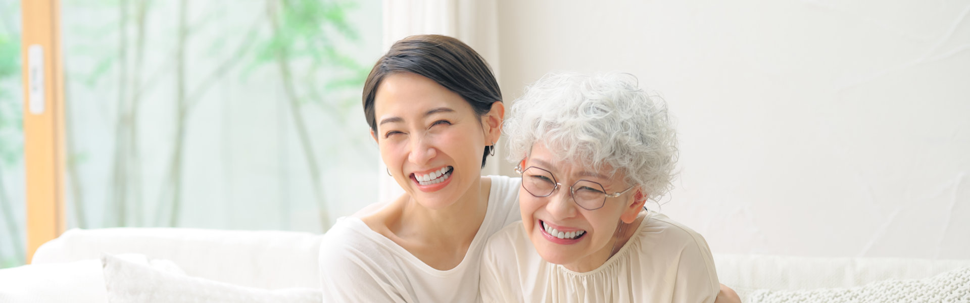 woman hugging senior