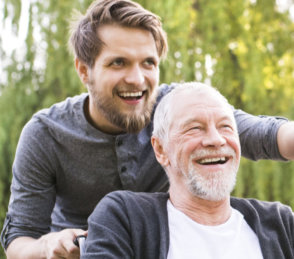 man and senior in wheelchair