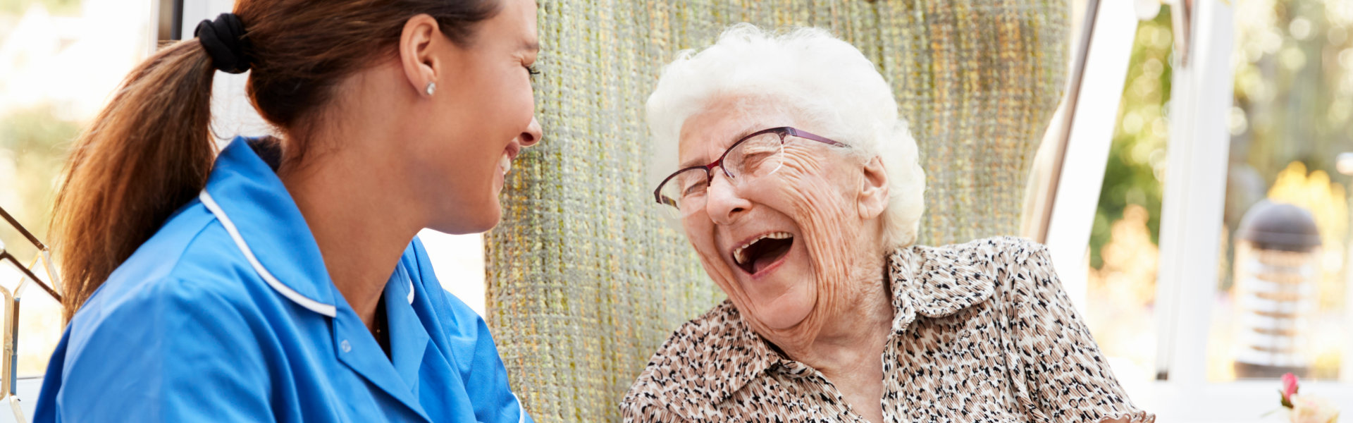 woman and senior laughing