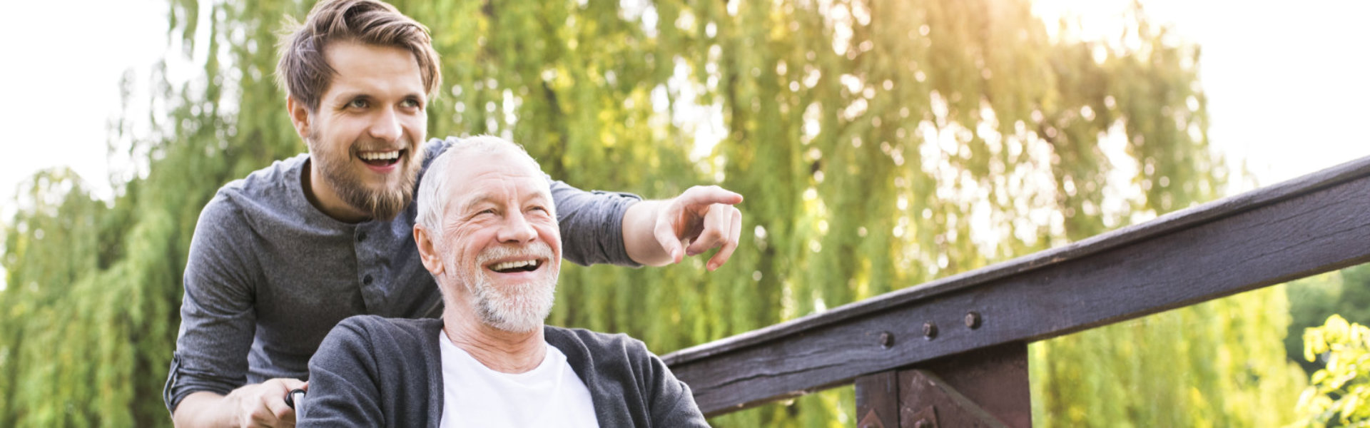 man and senior in wheelchair